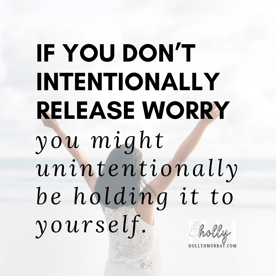 A woman in a white top standing on a beach with her arms lifted toward the ocean, symbolizing surrender to God and finding peace in a new season. This inspirational scene represents the spiritual stretch and trusting God's calling over personal comfort.